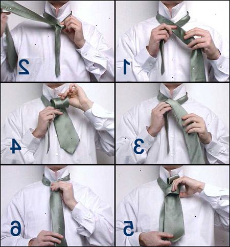 Hvordan man binder et slips. Flyt brede ende over den smalle ende, så de krydser hinanden på sømmen.